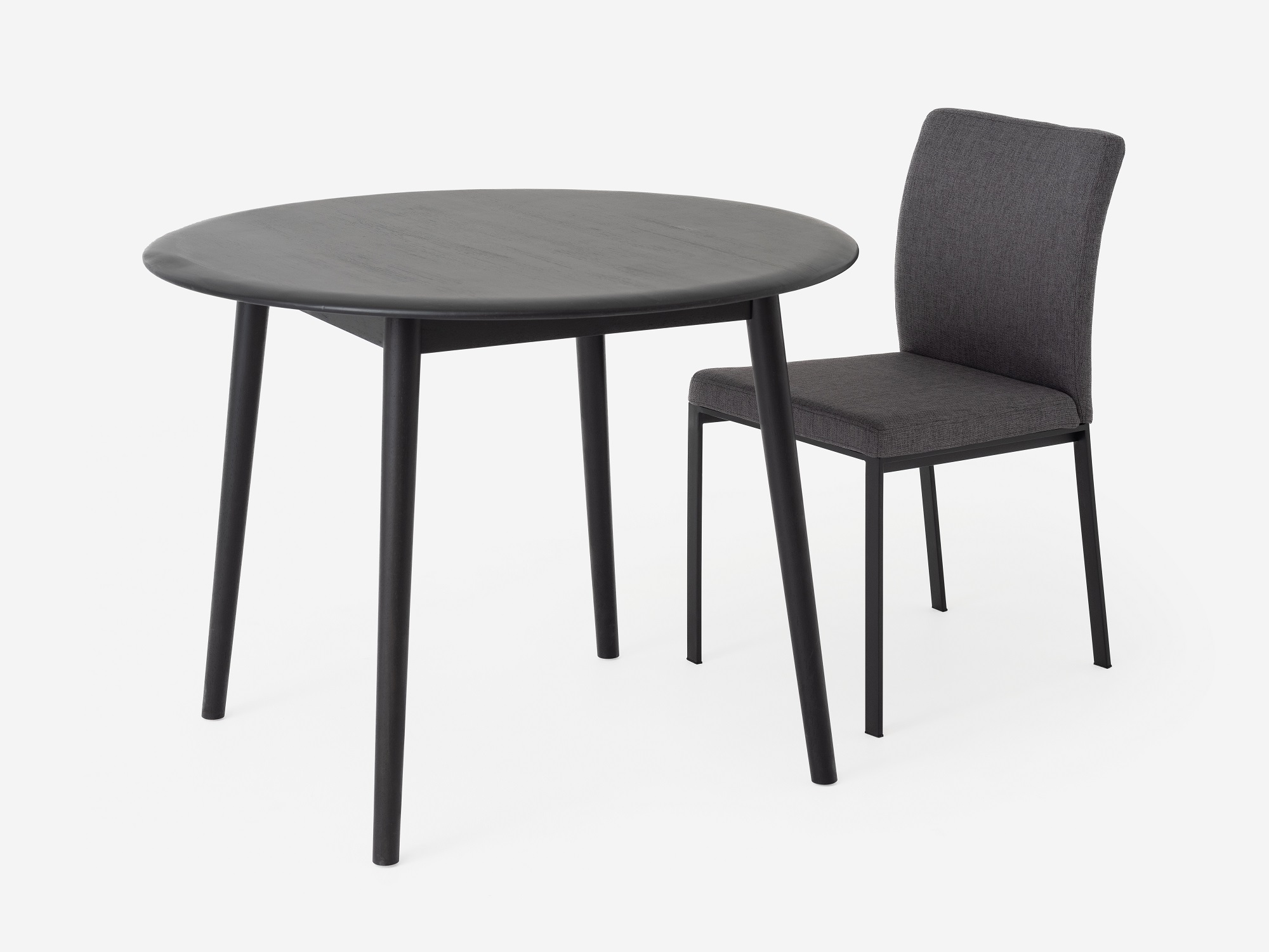 Grey modern dining room chair at round dinette table